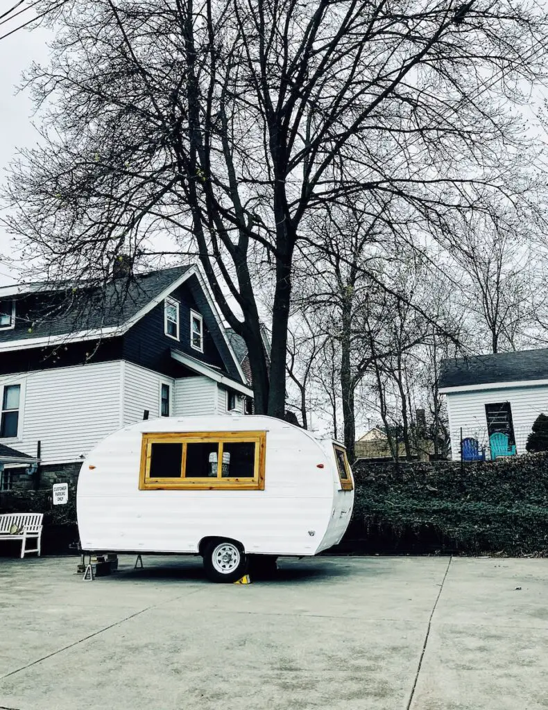 a trailer parked in front of a house