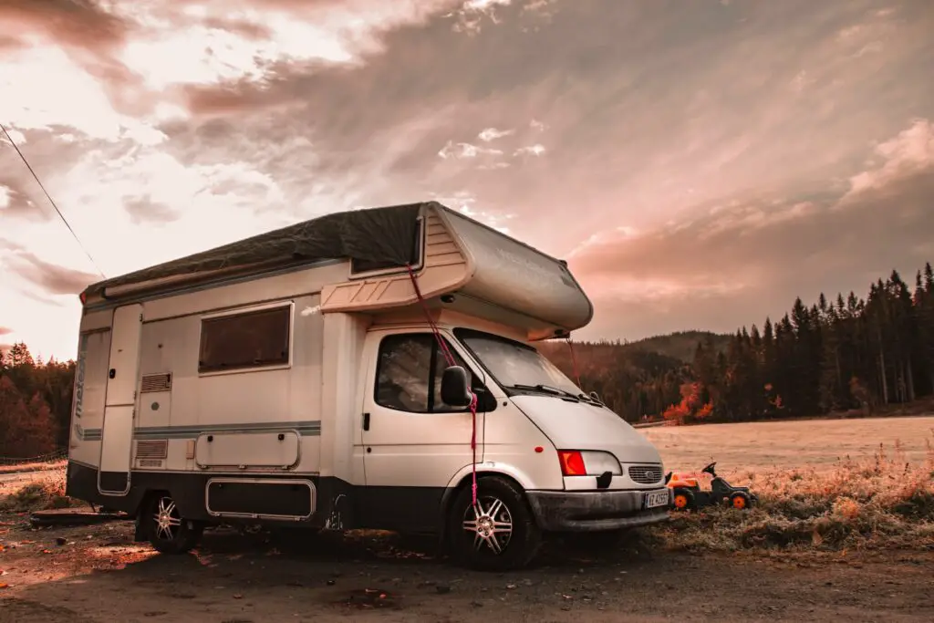 a white RV with a solar panel