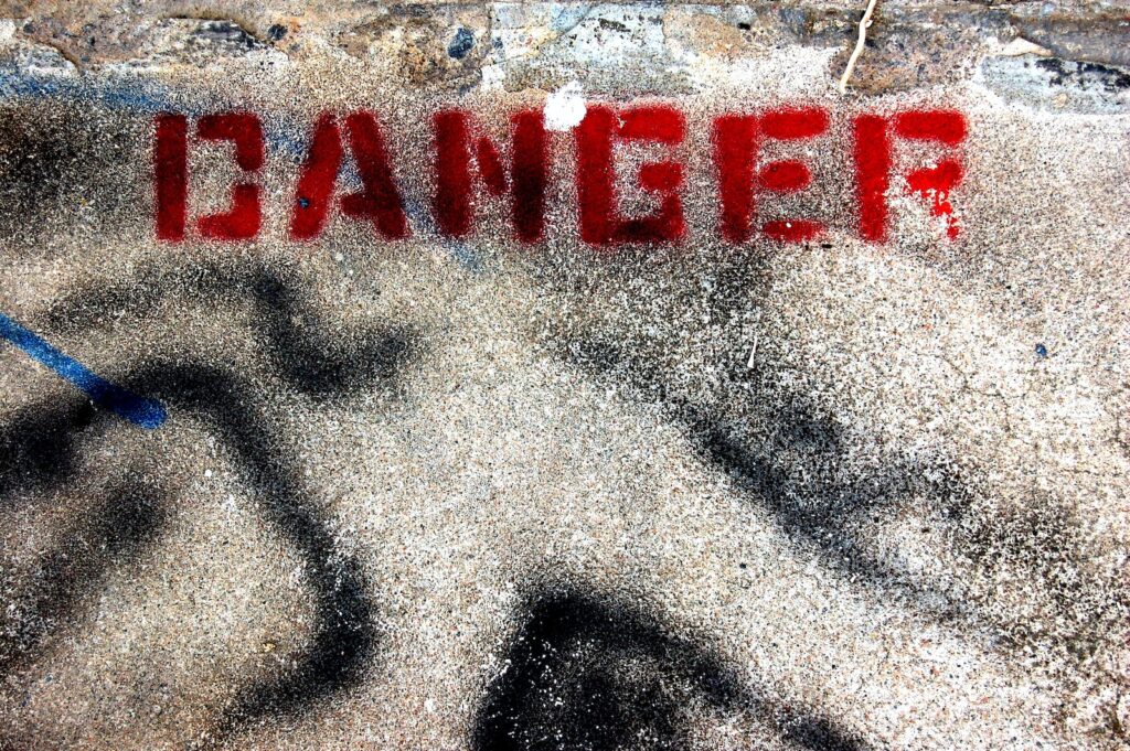 concrete ground with red danger text print