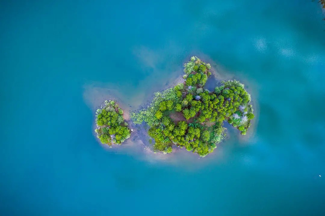 green island surrounded by body of water