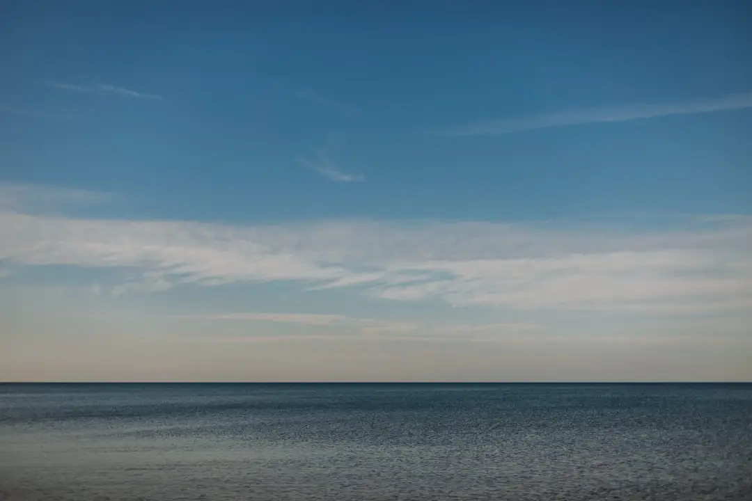 blue sky and white clouds over the sea