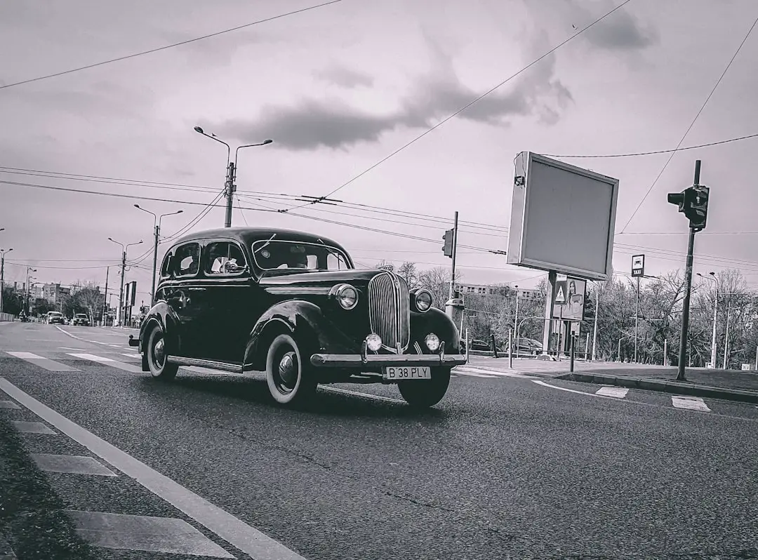 black vintage car on road during daytime