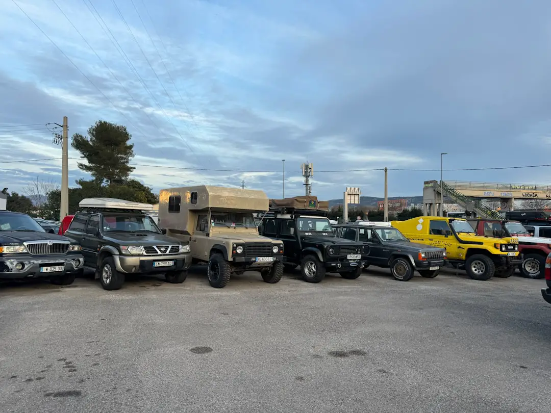 A parking lot filled with lots of trucks